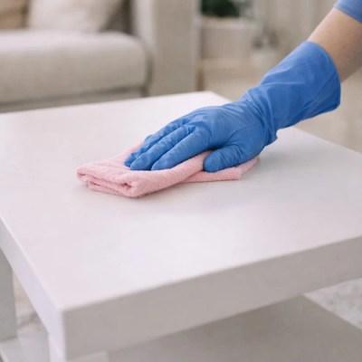 house cleaning Pittsburgh what include in living room Person cleaning table with cloth